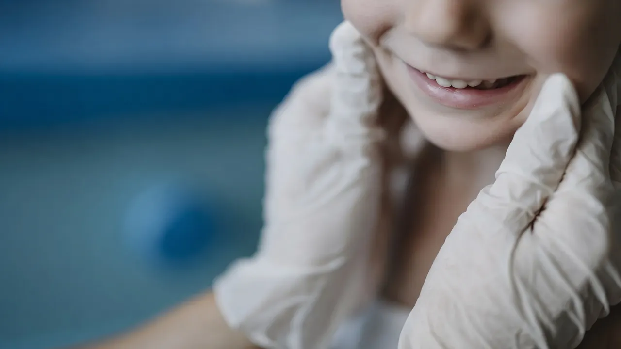 Child receiving dental checkup in a clinic