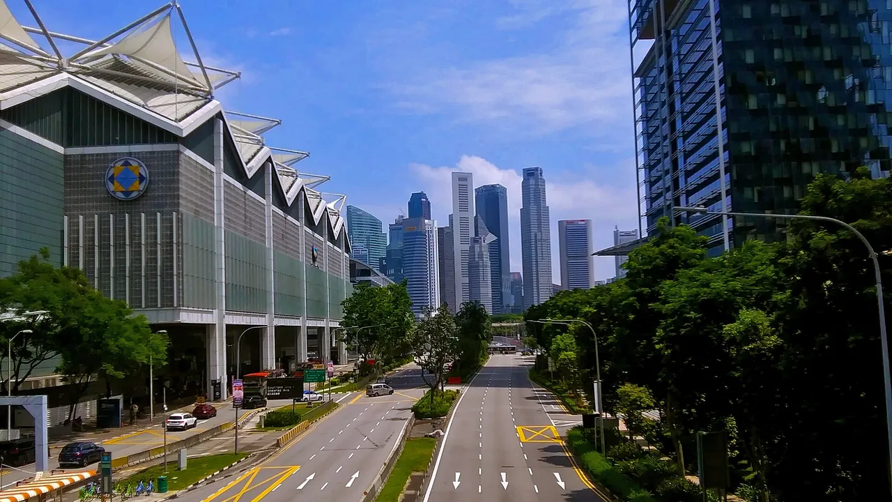 View south down Nicoll Highway from Suntec-South Beach pedestrian bridge towards Singapore Financial District