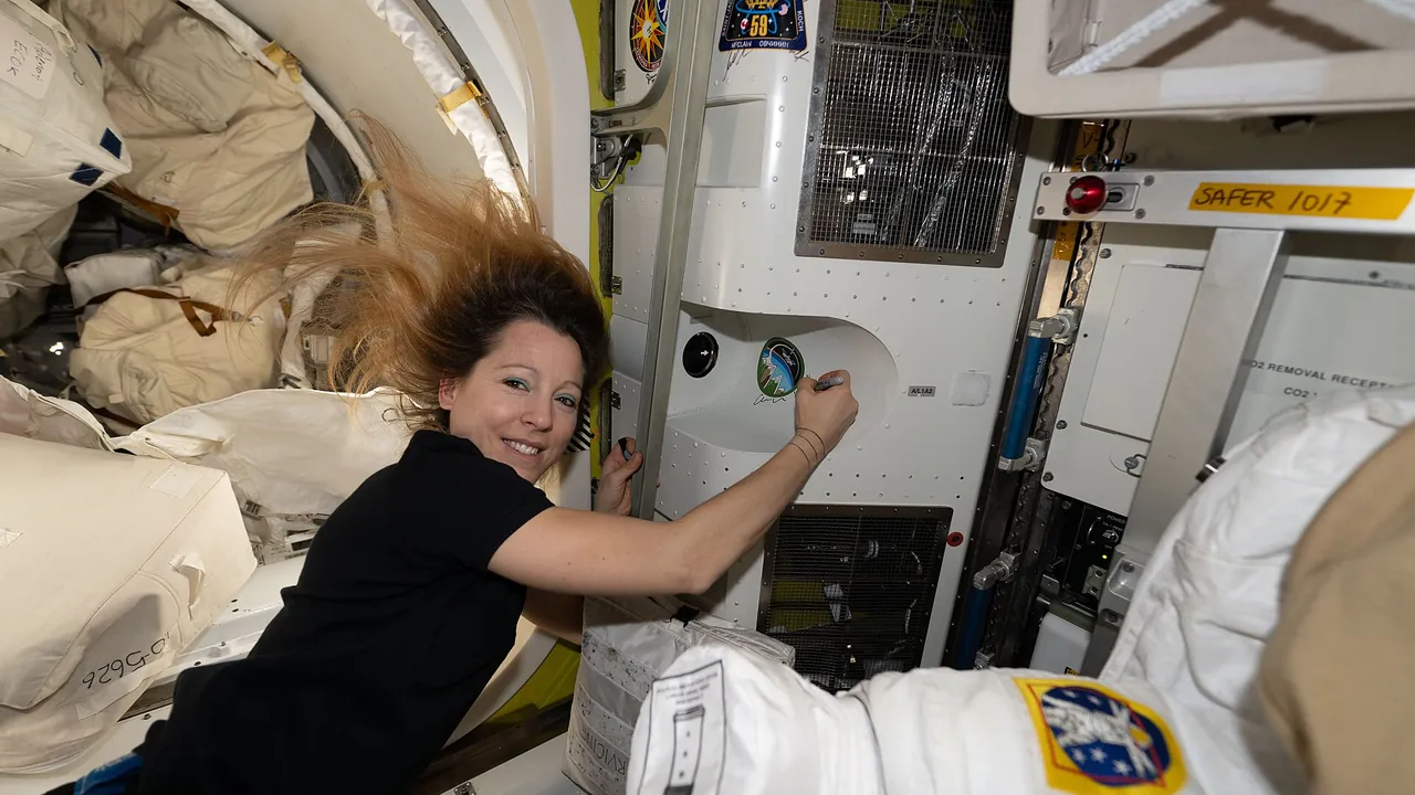 ESA astronaut Sophie Adenot signs her autograph inside the International Space Station (iss074e0812230)