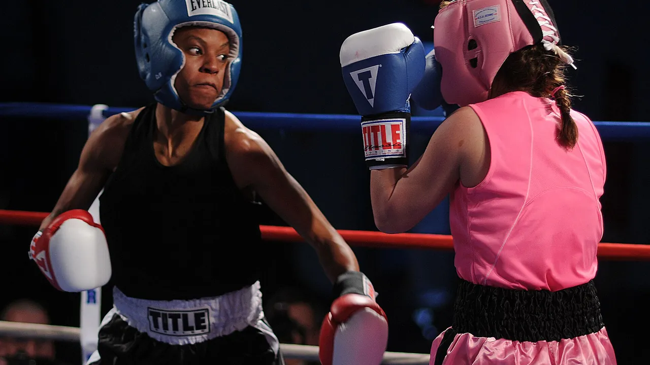 US Navy 110215-N-2610F-097 Master-at-Arms Seaman Rhonda McGee, left, spars with Patricia Cuevas during an exhibition mat