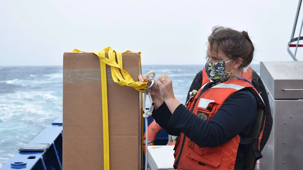 Research Specialist Heather Furey prepares an Argo float (OOI 261)