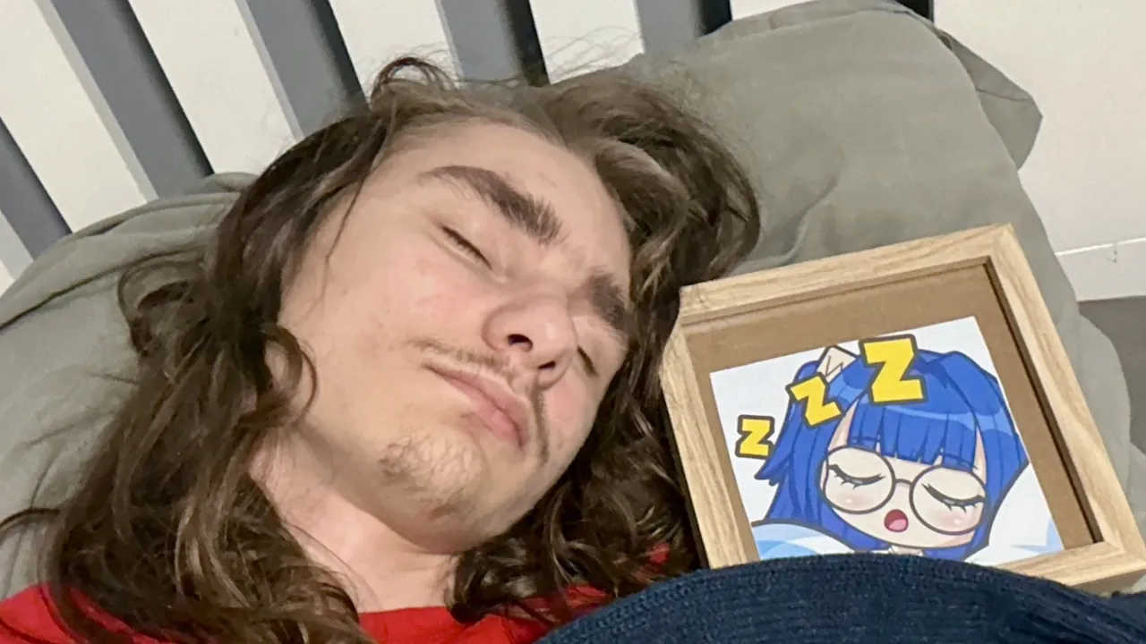 Man sleeping with framed picture