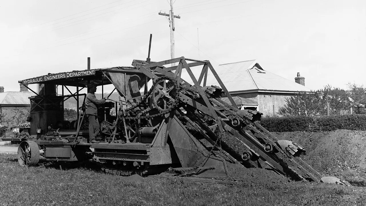 Earthmoving machinery digging ditches at Edwardstown for sewerage(GN12771)