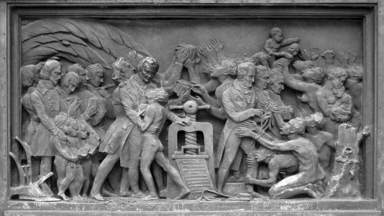 The printing press bringing freedom and European civilization to Africa - relief on the Gutenberg monument in Strasbourg