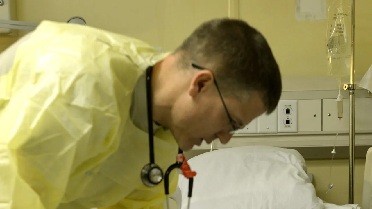 U.S. Air Force Lt. Col. David Jones, left, a pediatrician with the 455th Expeditionary Medical Group, examines an Afghan