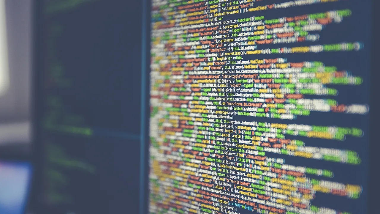 Code on computer monitor (Unsplash)