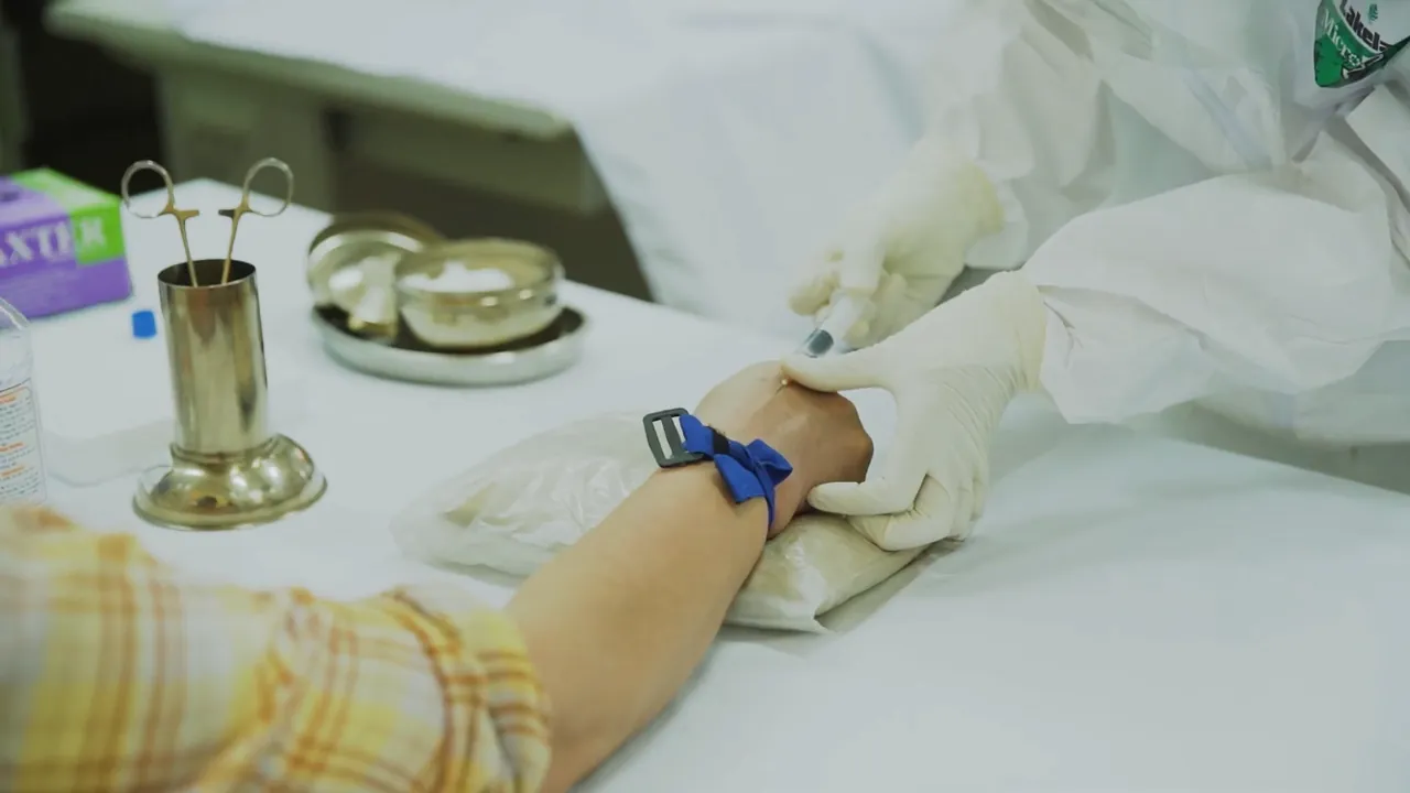 Doctor taking blood sample for COVID-19 rapid testing